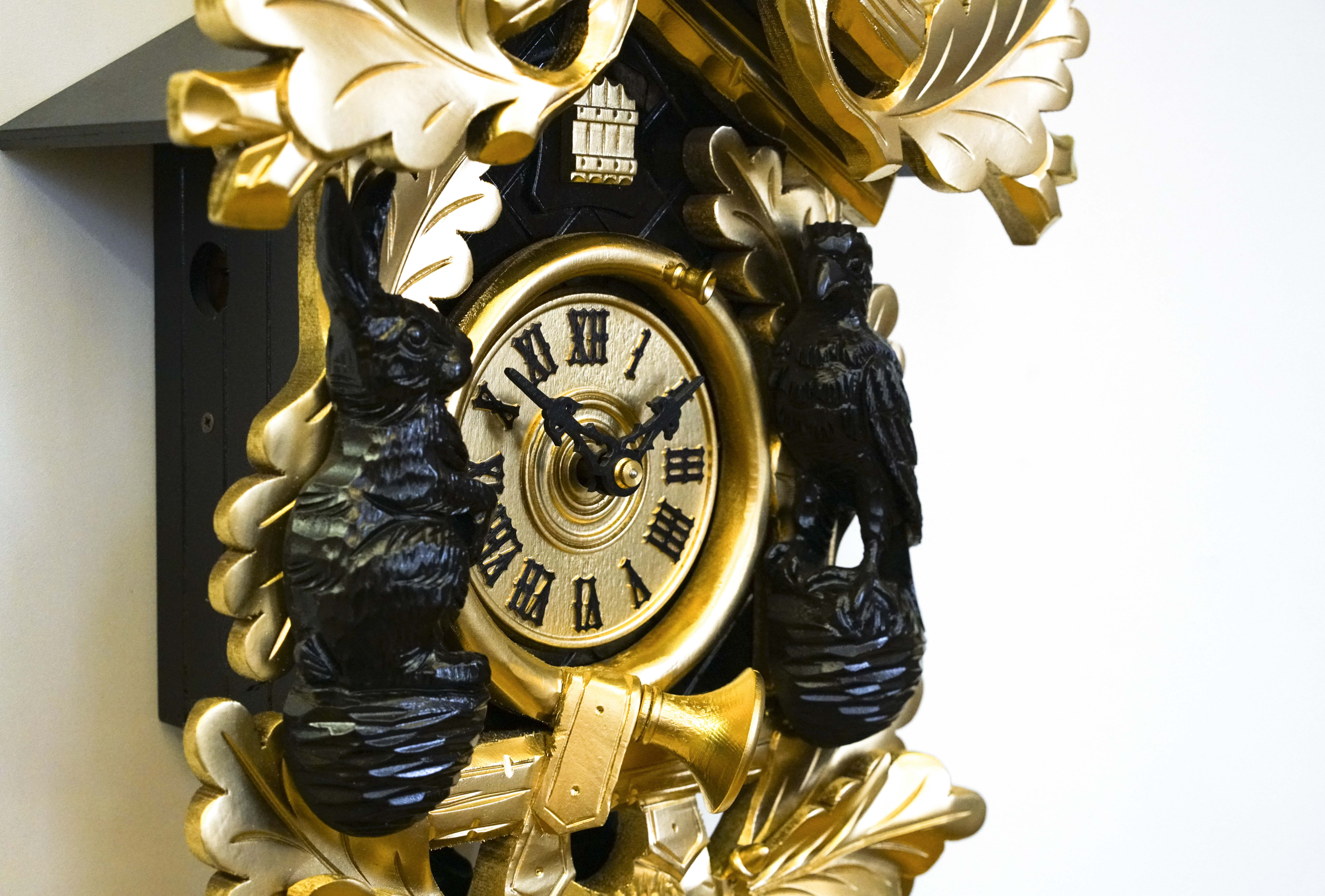 Kuckucksuhr gold/schwarz (Serie)